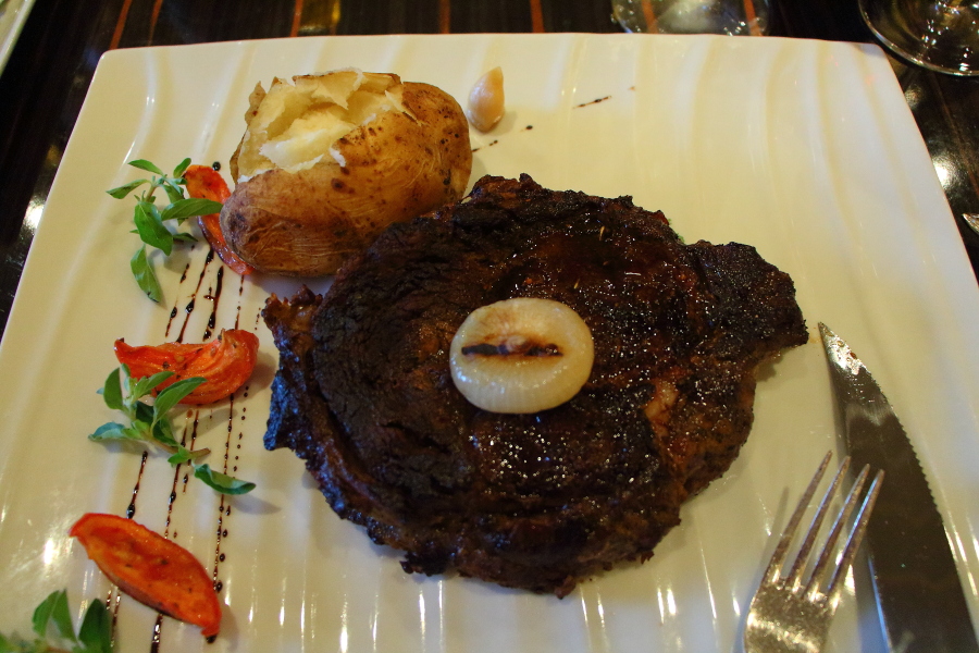 rubbed steak in Fahrenheit 555 steakhouse on Carnival Breeze