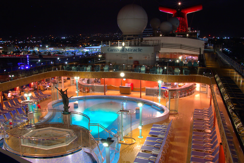 Carnival Miracle pool at night