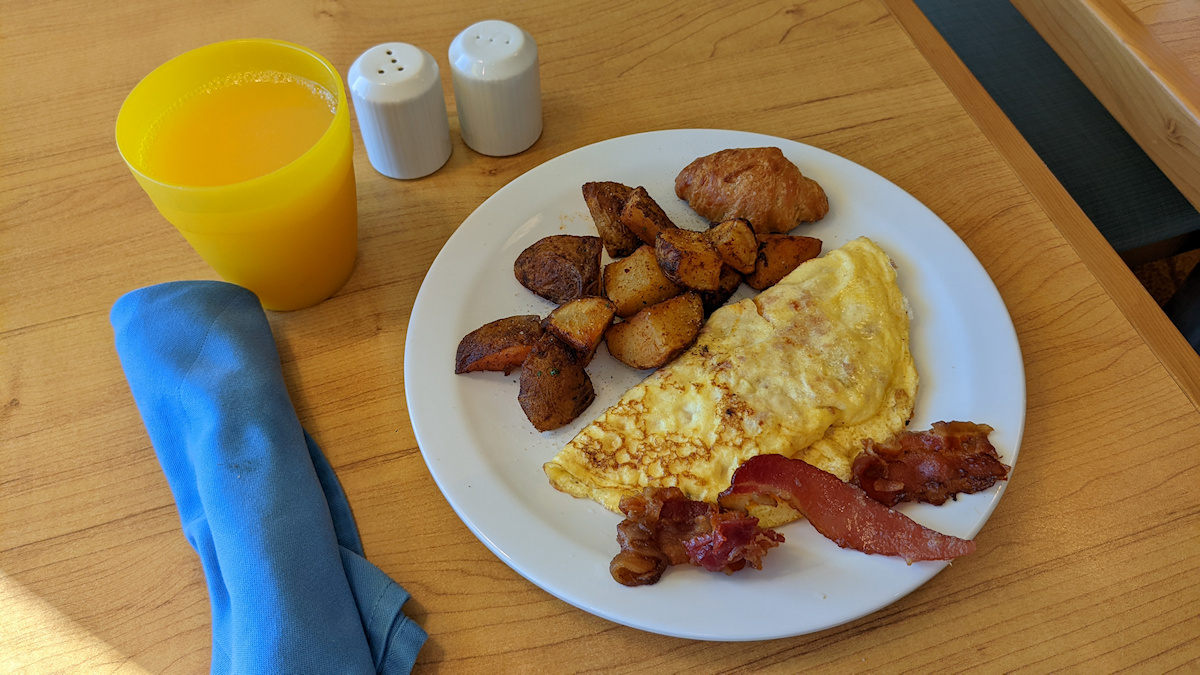 Omelette potatoes bacon croissant from Carnival buffet