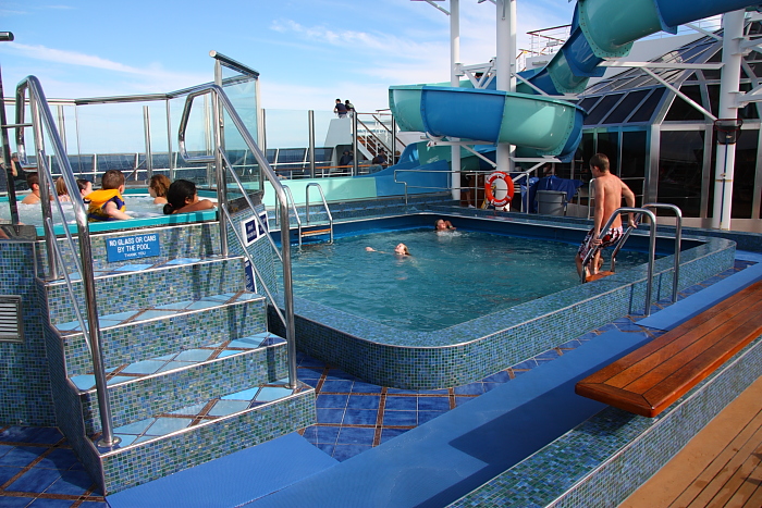 Children play in the swimming pool of the Carnival Splendor