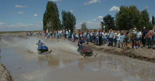 Racing snowmobiles in July